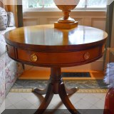 F26. Round inlayed drum table with drawers. 25&rdquo;h x 28&rdquo;w 